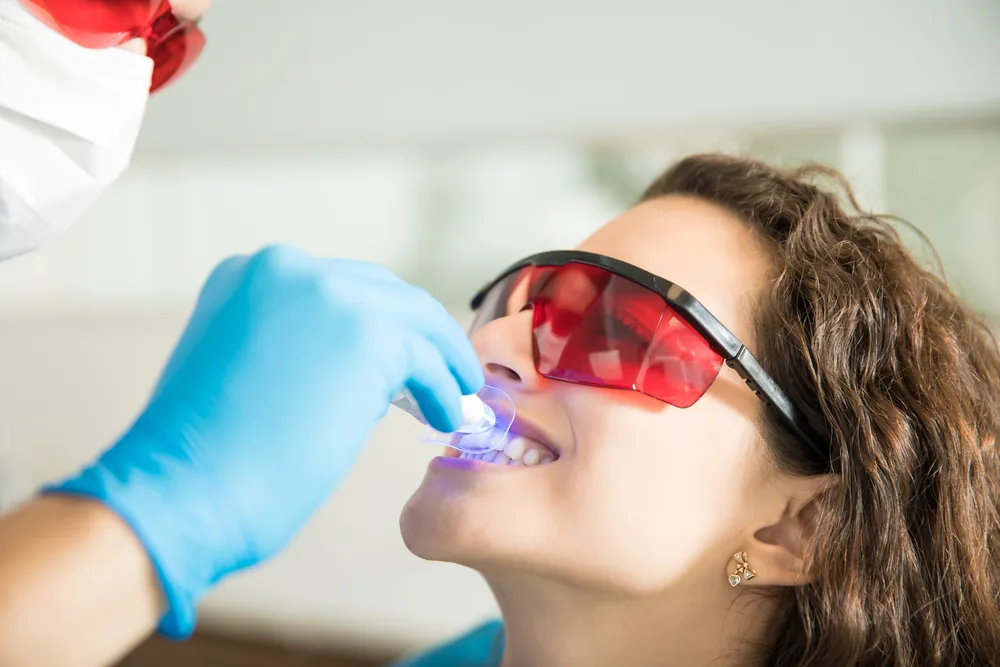 Patient having a laser teeth-whitening treatment